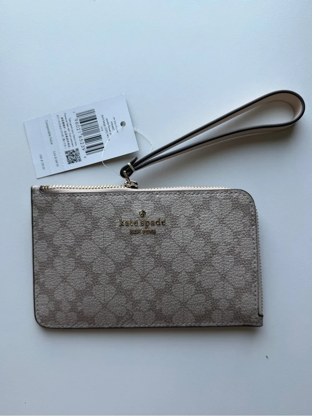 kate spade beige patterned wristlet card case with gold logo